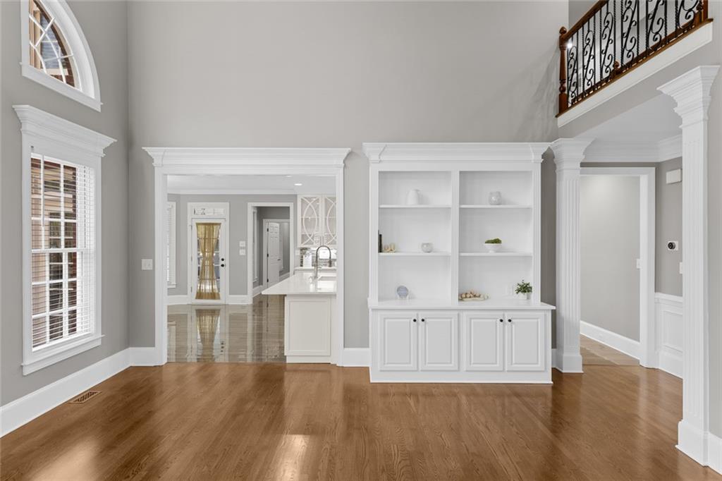 1225 Mobile Way Grayson, GA 30017 - Photo 13 of 51 wooden floor in an empty room with a window
