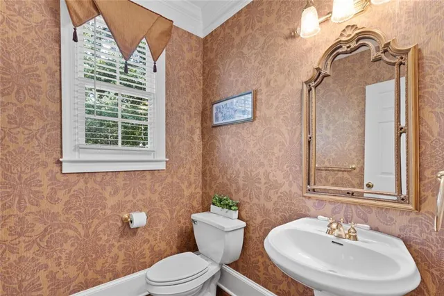 a bathroom with a granite countertop sink toilet a large mirror a bathtub and shower