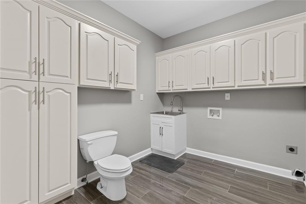 1225 Mobile Way Grayson, GA 30017 - Photo 20 of 51 a bathroom with a toilet