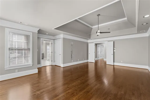 a view of walk in closet with empty racks