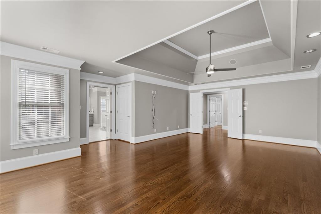 1225 Mobile Way Grayson, GA 30017 - Photo 23 of 51 a view of an empty room with window and wooden floor