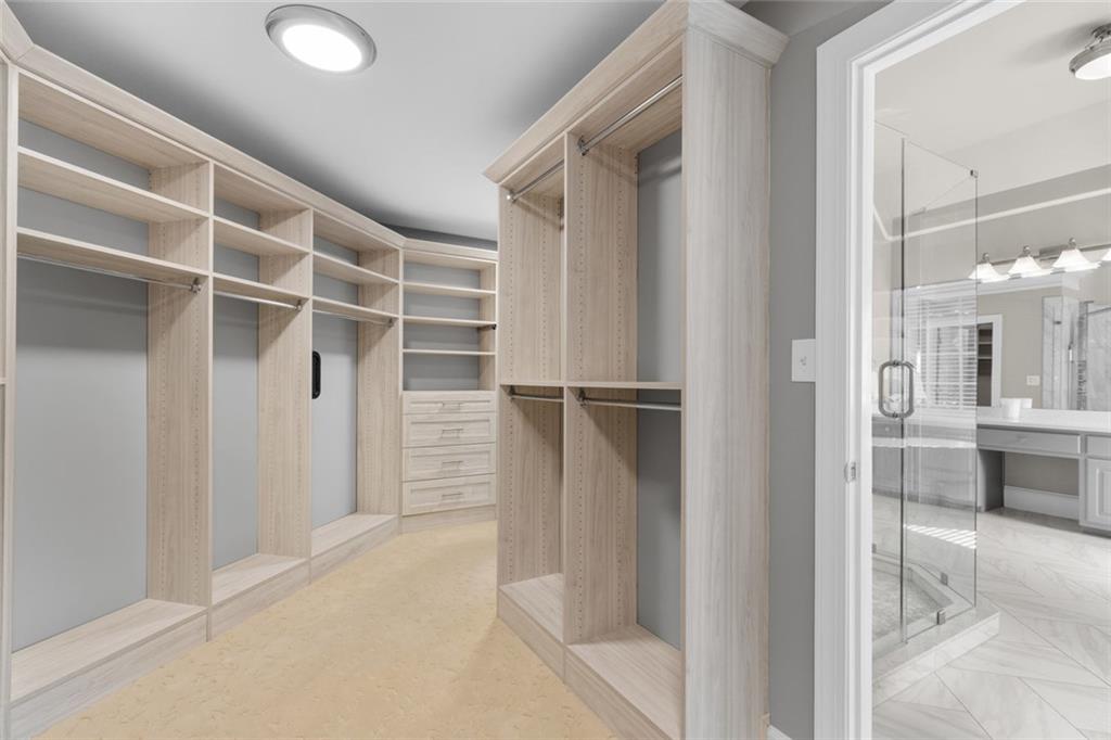 1225 Mobile Way Grayson, GA 30017 - Photo 26 of 51 a view of walk in closet with empty racks