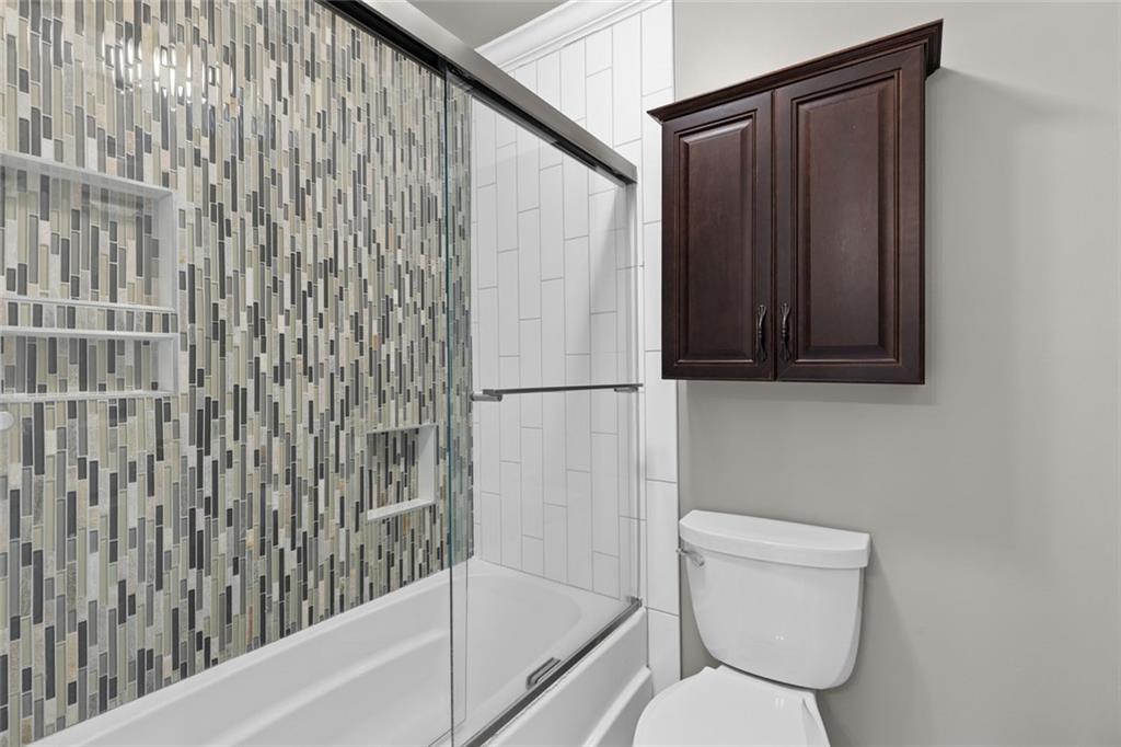 1225 Mobile Way Grayson, GA 30017 - Photo 29 of 51 a bathroom with a toilet and a shower