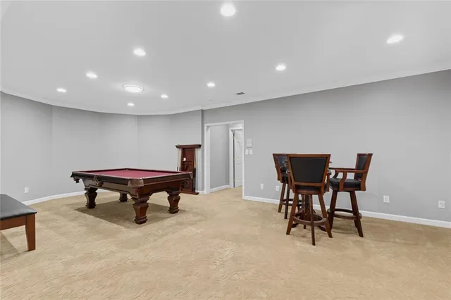 a media room with lots of chairs and a projector screen