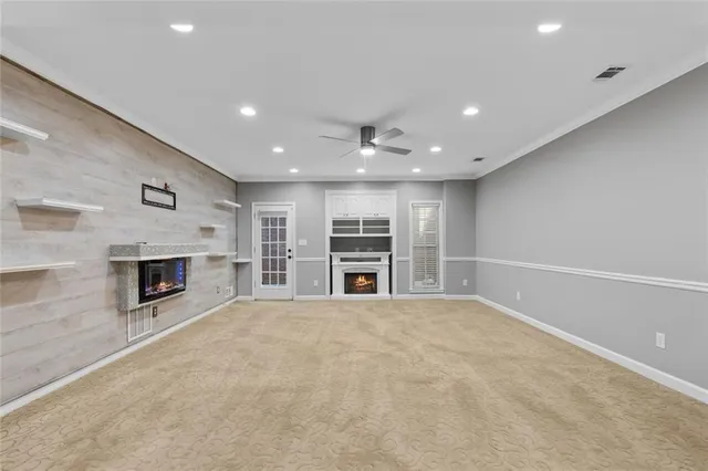 a room with gym equipment and white walls