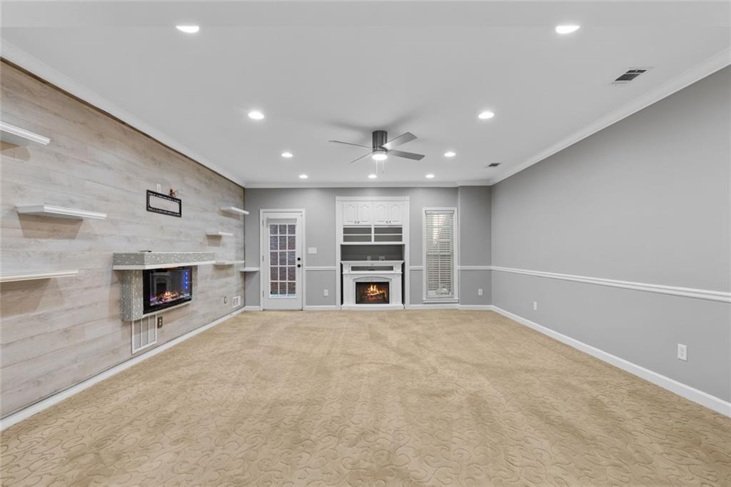 1225 Mobile Way Grayson, GA 30017 - Photo 36 of 51 a view of a livingroom with a fireplace cabinet and window