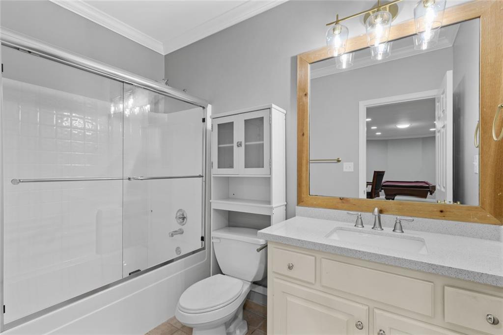 1225 Mobile Way Grayson, GA 30017 - Photo 37 of 51 a bathroom with a sink a toilet and shower