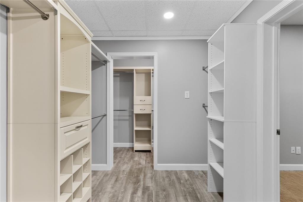1225 Mobile Way Grayson, GA 30017 - Photo 40 of 51 a view of walk in closet with empty racks