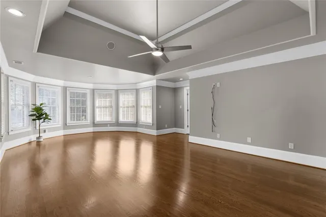 a large bathroom with a double vanity sink a mirror and a bathtub