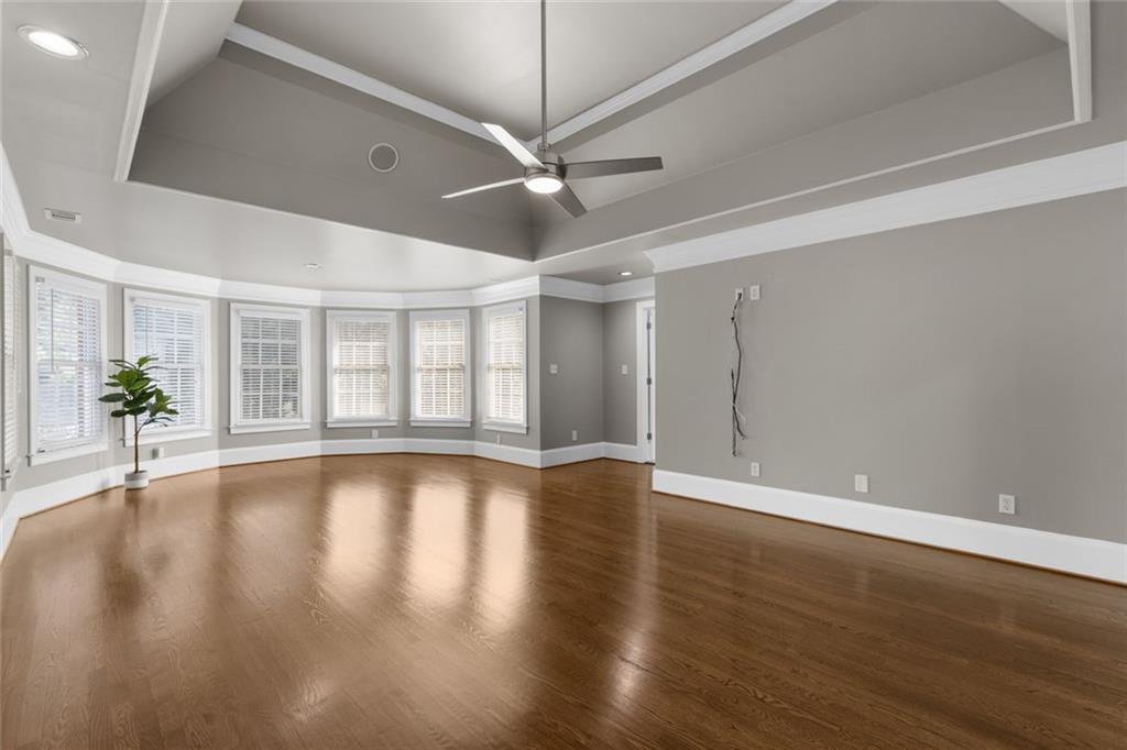 1225 Mobile Way Grayson, GA 30017 - Photo 4 of 51 a view of an empty room with wooden floor and a window