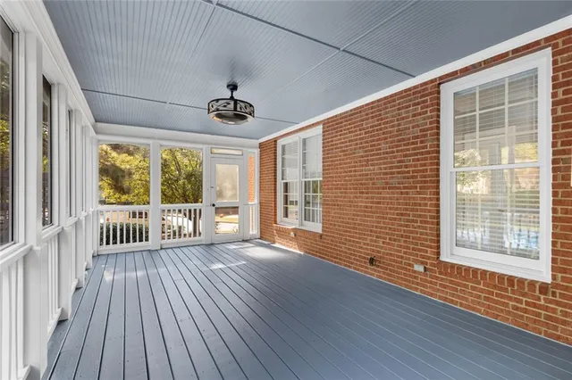 a view of a swimming pool with chairs