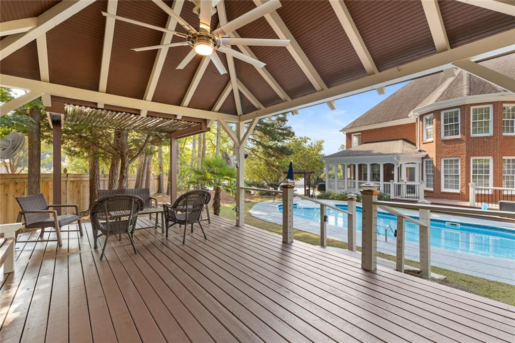 1225 Mobile Way Grayson, GA 30017 - Photo 43 of 51 a view of a patio with table and chairs and wooden floor