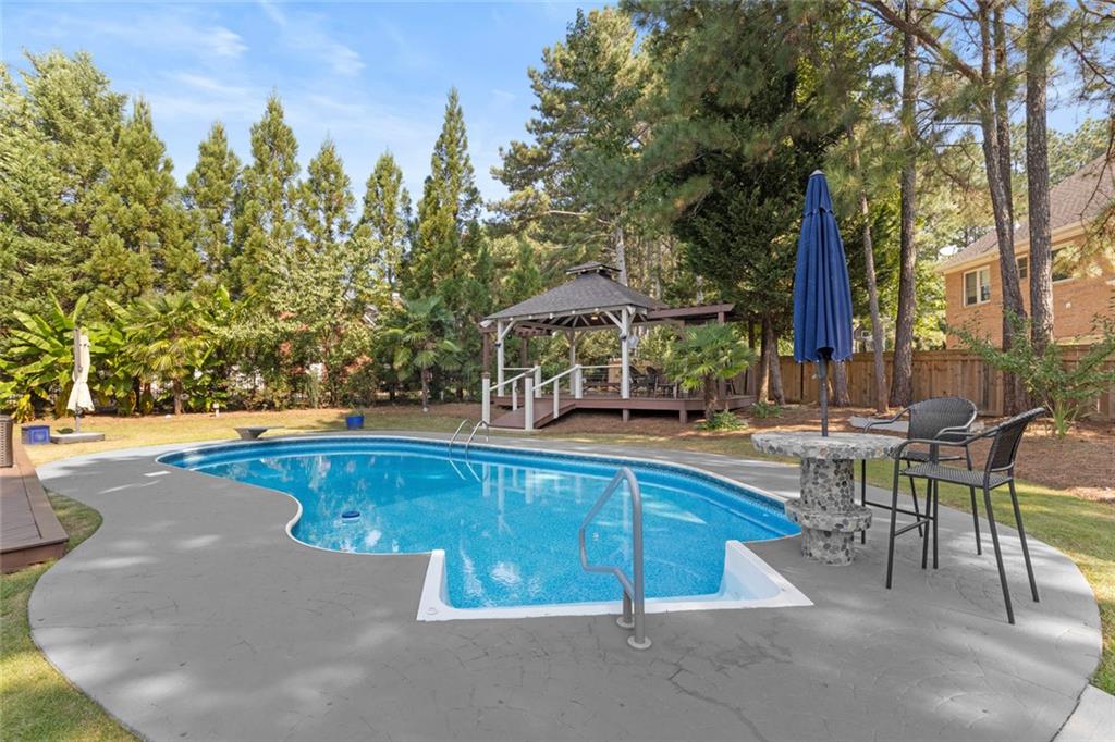 1225 Mobile Way Grayson, GA 30017 - Photo 46 of 51 a view of a swimming pool with chairs