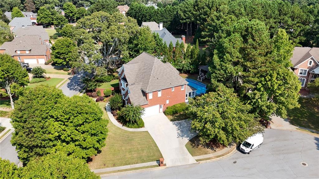 1225 Mobile Way Grayson, GA 30017 - Photo 49 of 51 an aerial view of a house with a yard and garden