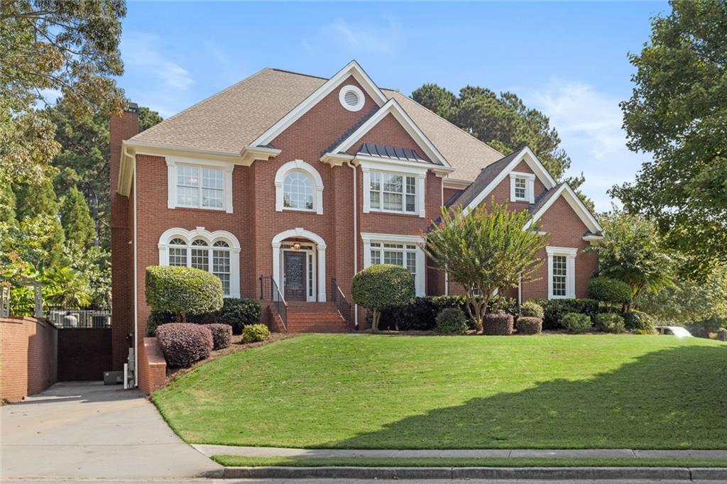 1225 Mobile Way Grayson, GA 30017 - Photo 6 of 51 a front view of a house with garden