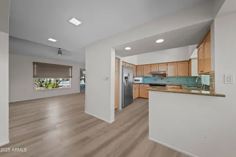 a view of kitchen with wooden floor
