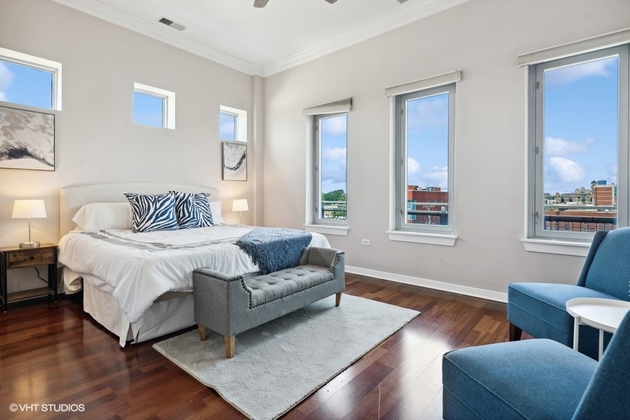 3920 North Sheridan Road, Unit 504 Chicago, IL 60613 - Photo 12 of 21 a bedroom with furniture and a window