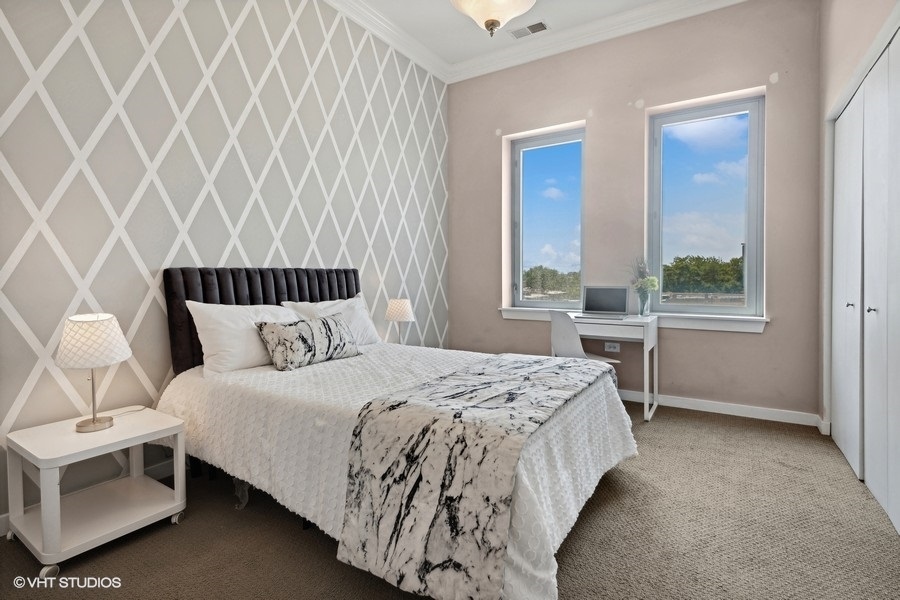 3920 North Sheridan Road, Unit 504 Chicago, IL 60613 - Photo 16 of 21 a bedroom with a bed and a window