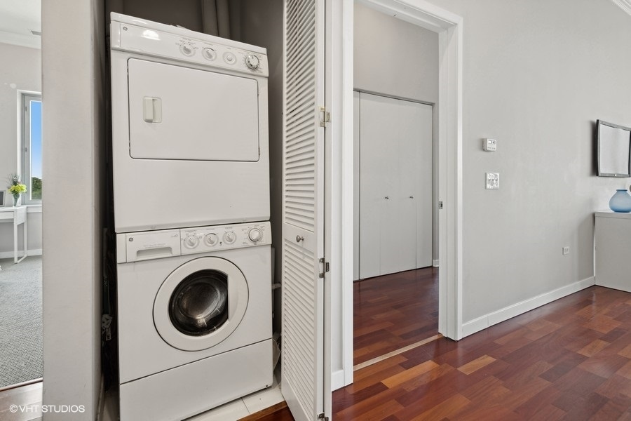 3920 North Sheridan Road, Unit 504 Chicago, IL 60613 - Photo 19 of 21 a view of a hallway with washer and dryer