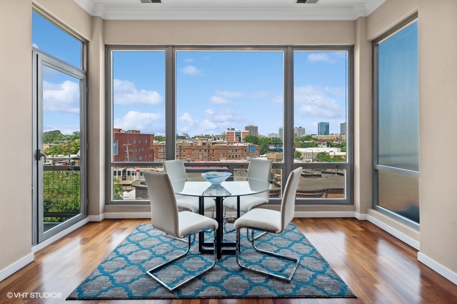 3920 North Sheridan Road, Unit 504 Chicago, IL 60613 - Photo 5 of 21 a dining room with furniture and wooden floor