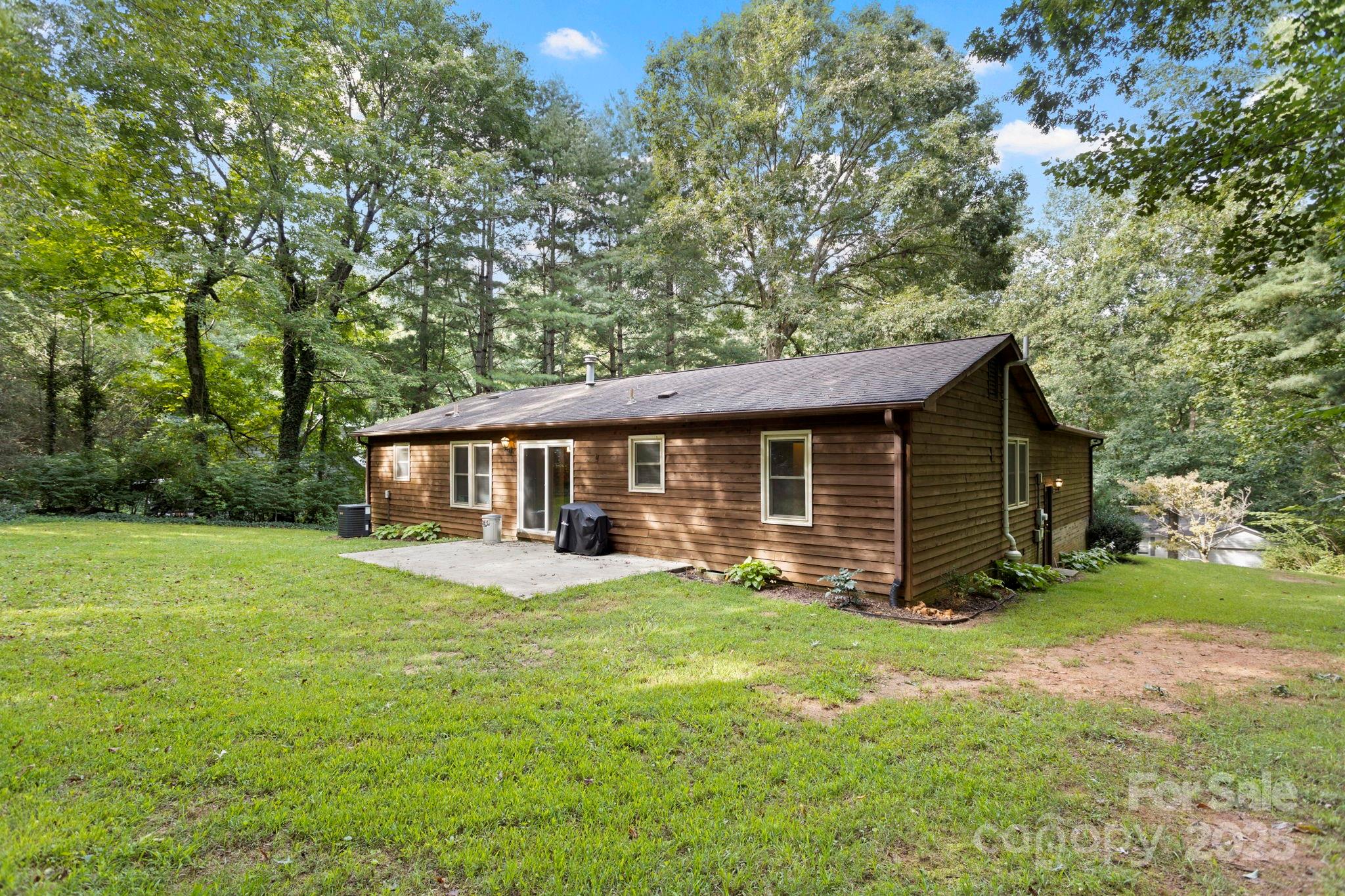 207 Mint Way Flat Rock, NC 28731 - Photo 24 of 27 a view of a house with a yard