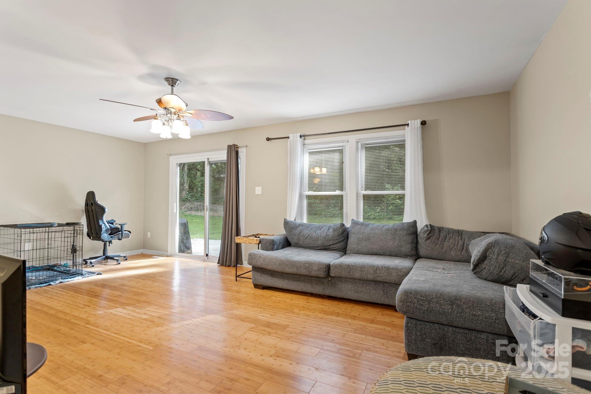 207 Mint Way Flat Rock, NC 28731 - Photo 6 of 27 a living room with furniture and a large window