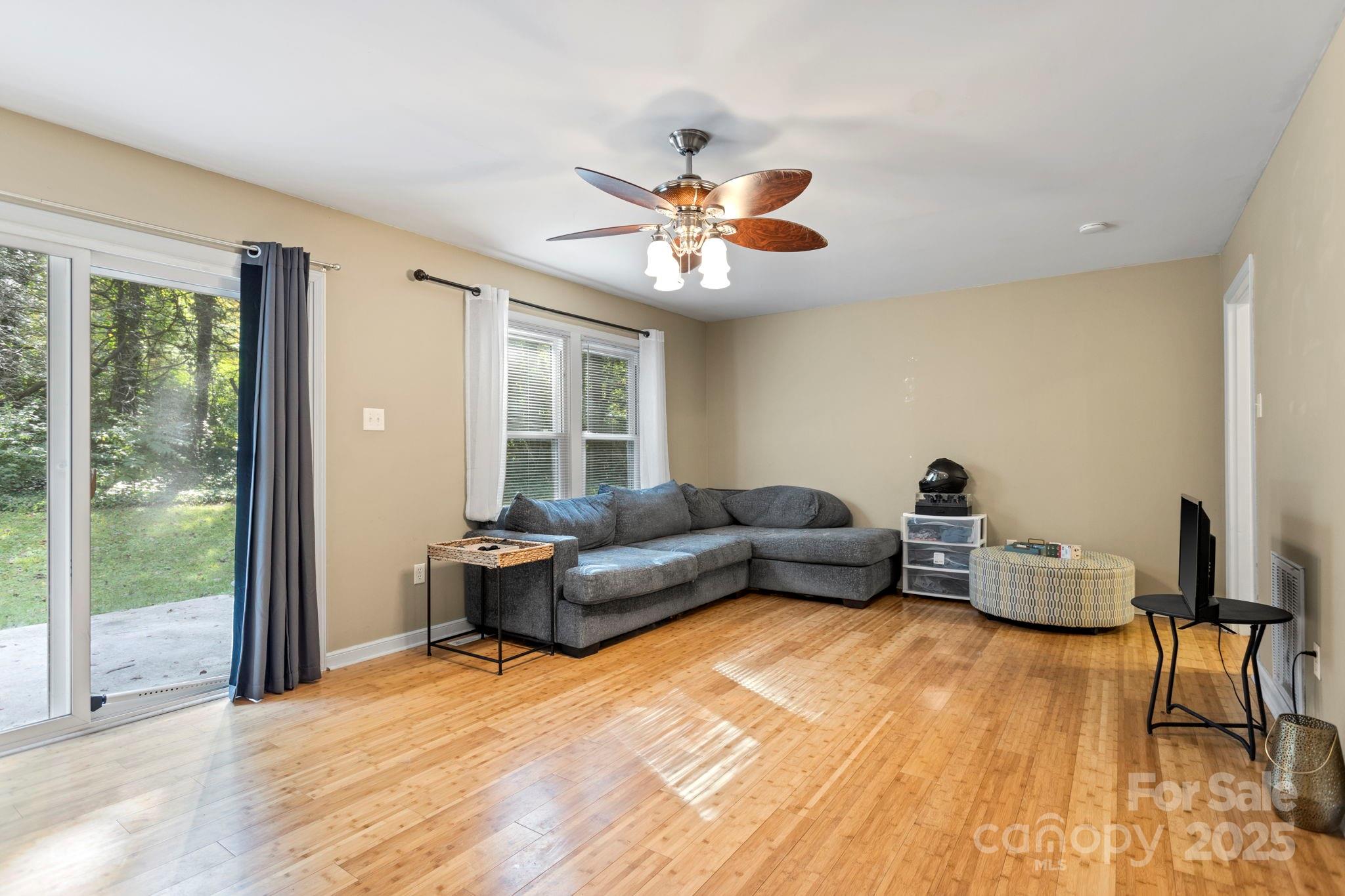 207 Mint Way Flat Rock, NC 28731 - Photo 8 of 27 a living room with furniture and a large window