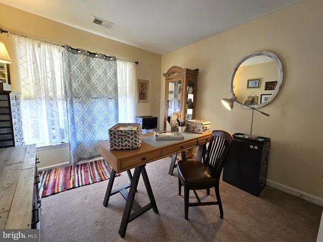 a view of a livingroom with furniture and window