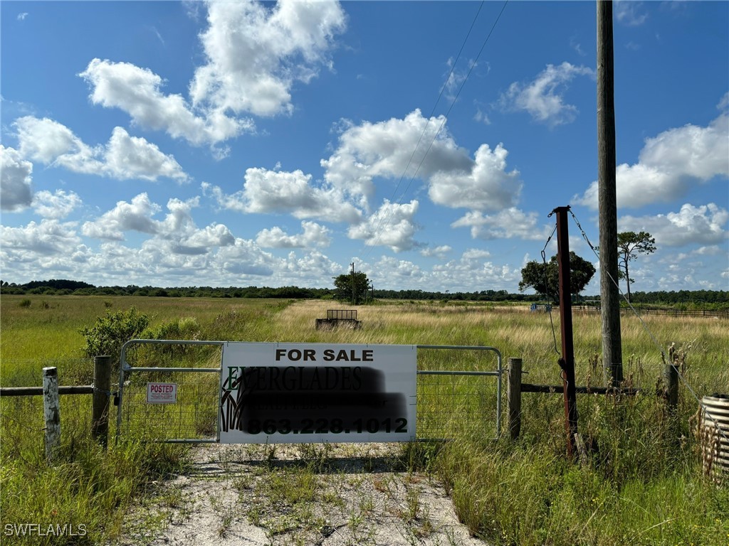 2516 Christopher Lane Clewiston, FL 33440 - Photo 3 of 13 a view of a lake with a big yard