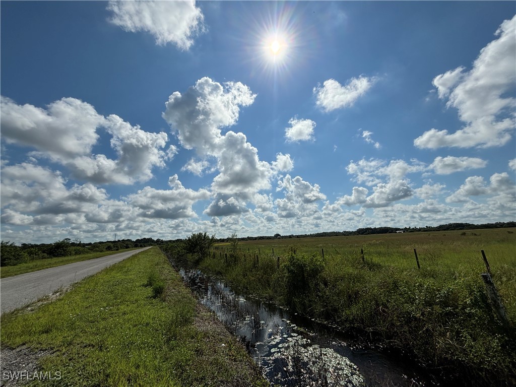 2516 Christopher Lane Clewiston, FL 33440 - Photo 6 of 13 a view of a lake from a yard