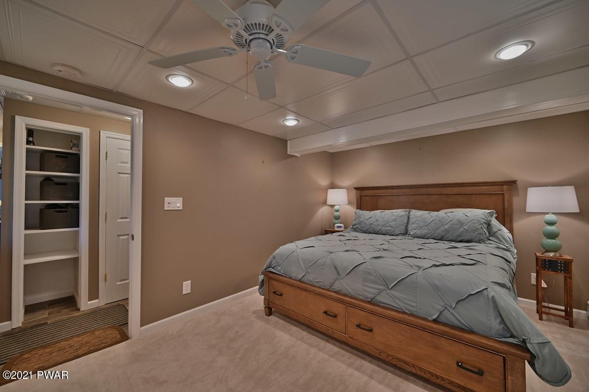 76 Rockway Road Lake Ariel, PA 18436 - Photo 79 of 101 a bedroom with a bed and a ceiling fan