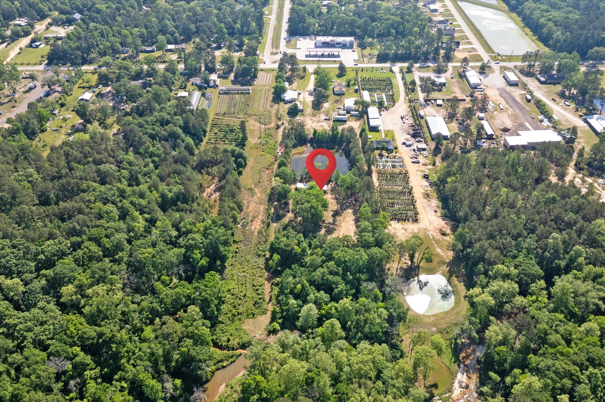 4804 Crockett Martin Road Conroe, TX 77306 - Photo 13 of 16 an aerial view of residential houses with outdoor space and trees