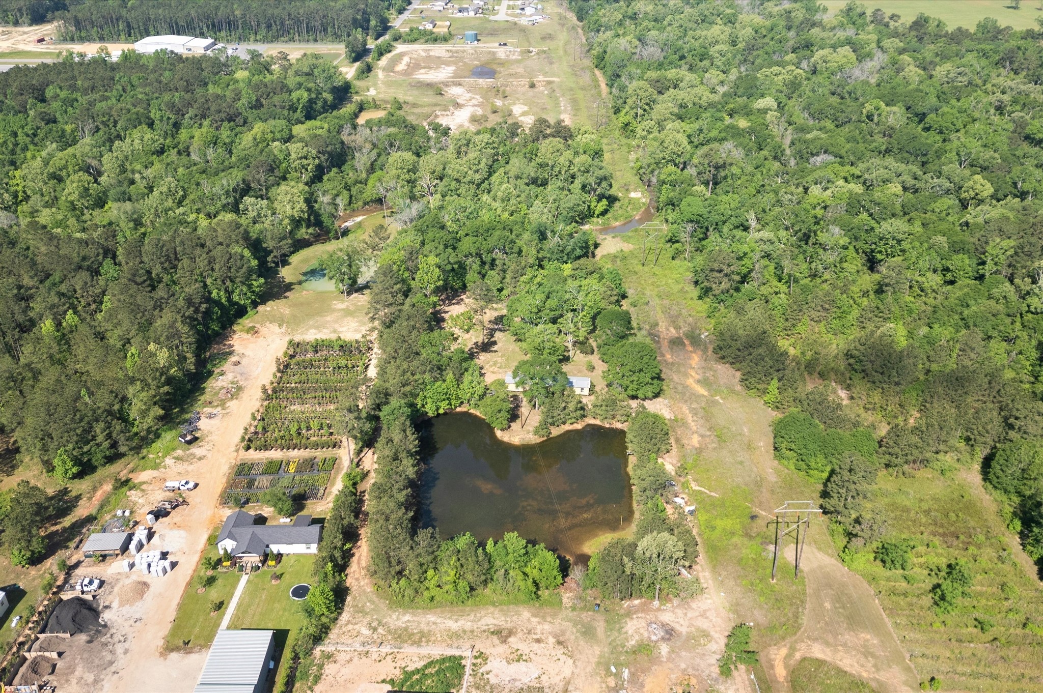 4804 Crockett Martin Road Conroe, TX 77306 - Photo 4 of 16 a view of residential house with swimming pool and lawn chairs