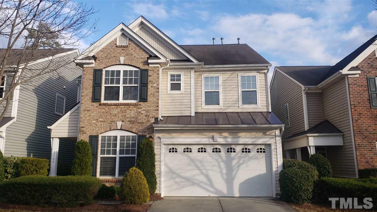 9708 Renfield Drive Raleigh, NC 27617 - Photo 1 of 24 a front view of a house with a yard