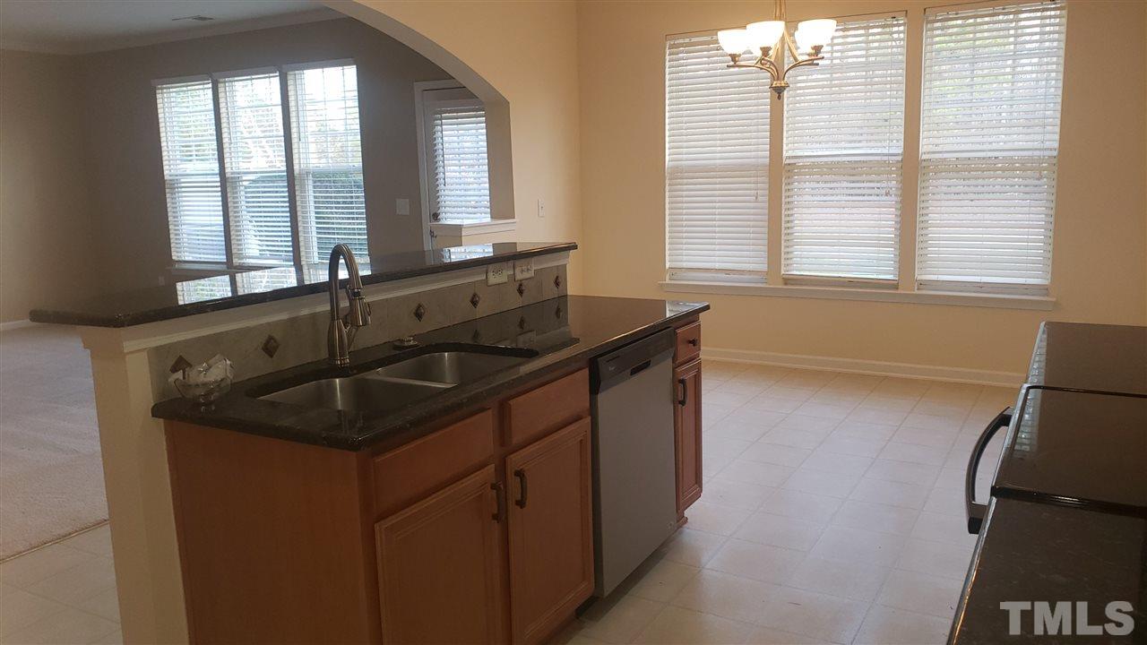 9708 Renfield Drive Raleigh, NC 27617 - Photo 11 of 24 a kitchen with a sink and a window