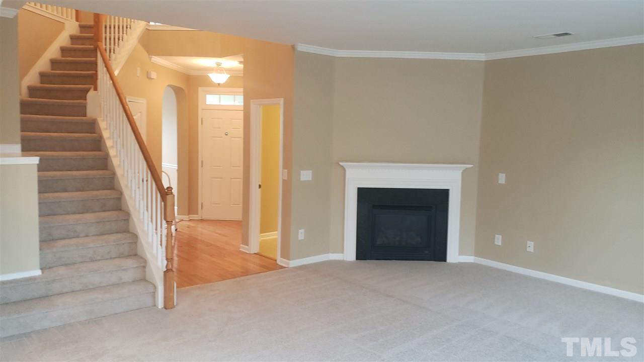 9708 Renfield Drive Raleigh, NC 27617 - Photo 13 of 24 a view of an entryway with staircase