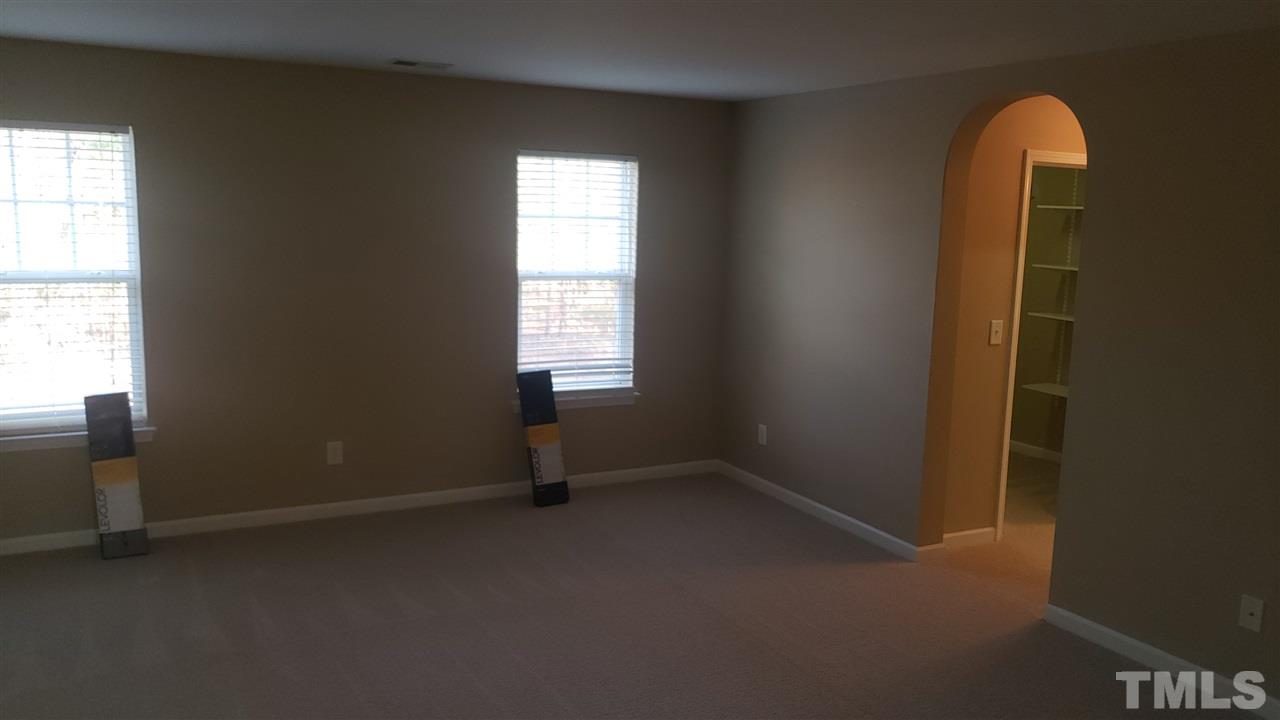 9708 Renfield Drive Raleigh, NC 27617 - Photo 15 of 24 an empty room that has a window in it