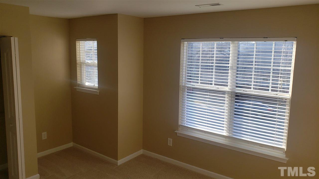 9708 Renfield Drive Raleigh, NC 27617 - Photo 17 of 24 a view of a bathroom that has a window in it