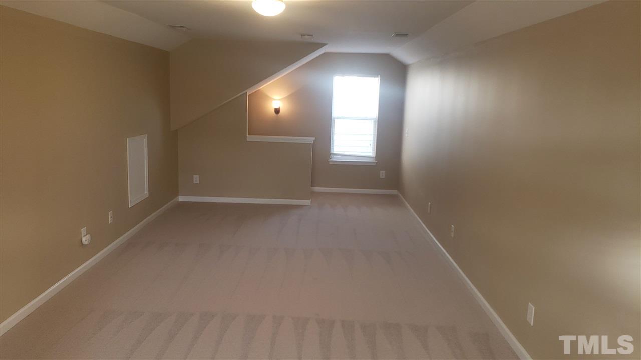 9708 Renfield Drive Raleigh, NC 27617 - Photo 21 of 24 an empty room with windows