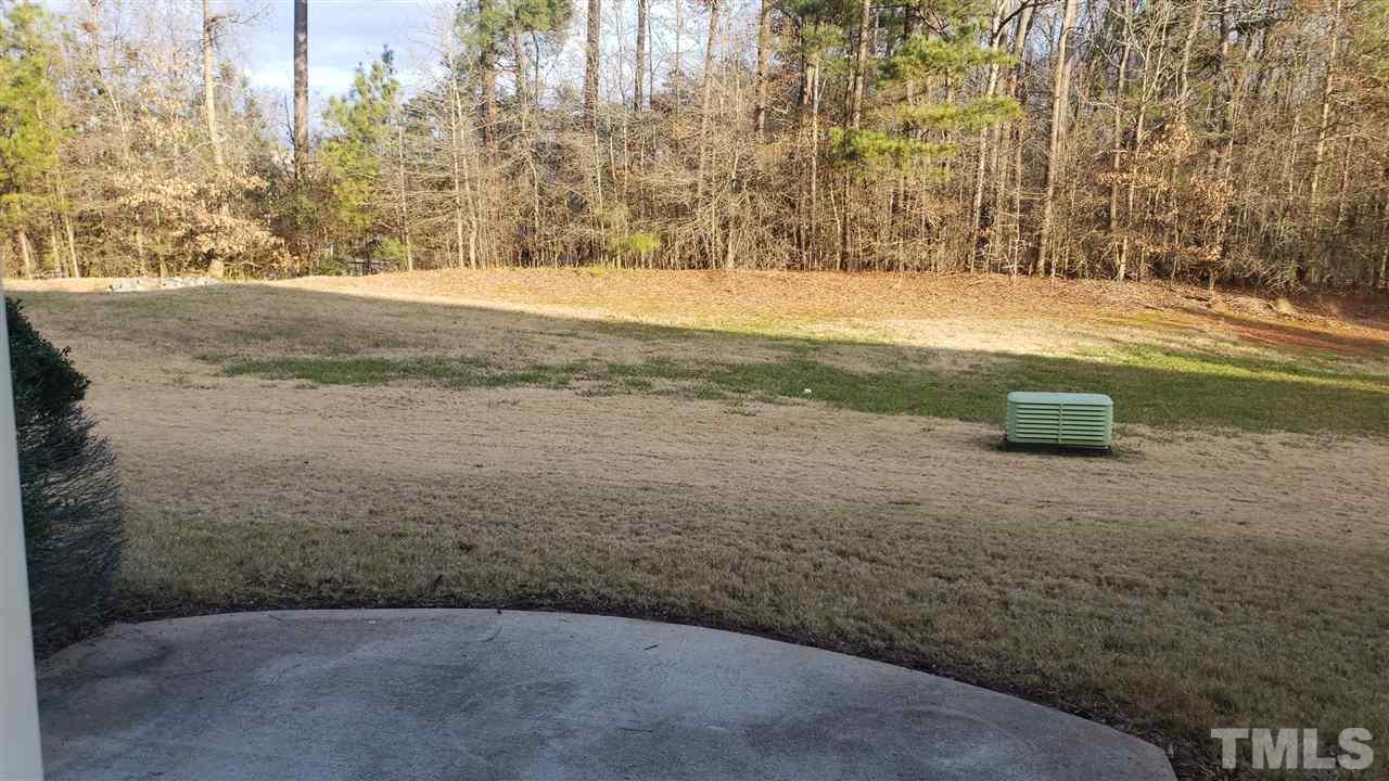 9708 Renfield Drive Raleigh, NC 27617 - Photo 22 of 24 a view of a yard with an empty space