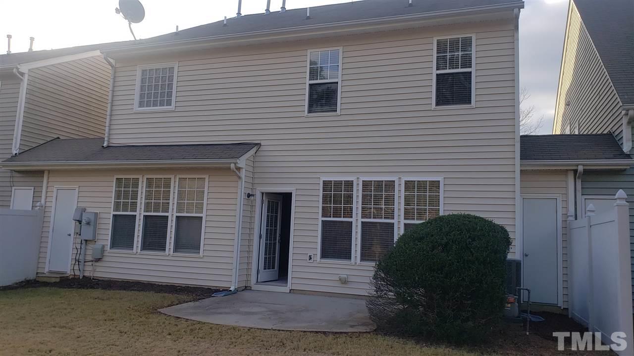 9708 Renfield Drive Raleigh, NC 27617 - Photo 24 of 24 a view of a house with backyard and a chair