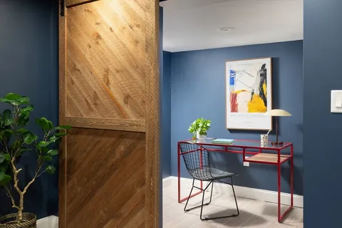 a workspace with furniture and wooden floor