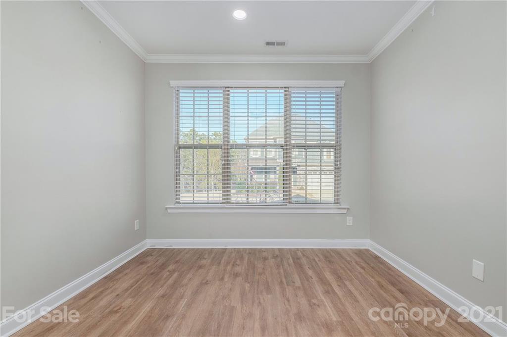 120 Helton Lane Fort Mill, SC 29708 - Photo 12 of 21 an empty room with wooden floor and windows