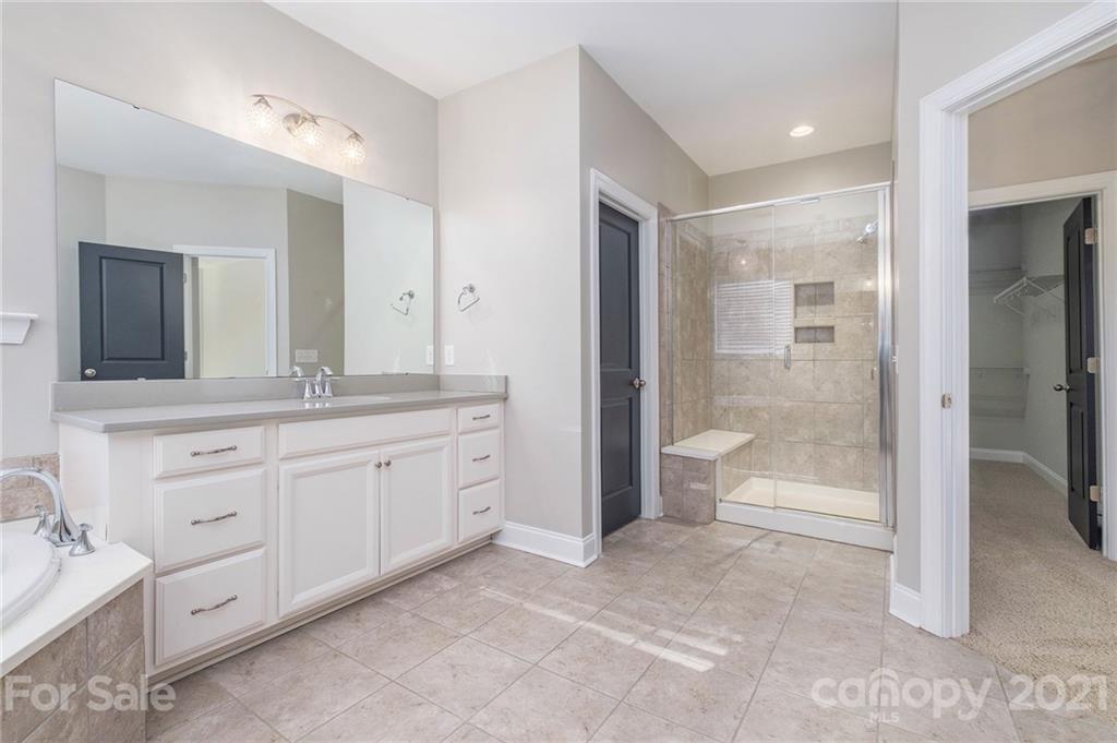 120 Helton Lane Fort Mill, SC 29708 - Photo 15 of 21 a spacious bathroom with a shower sink mirror and toilet