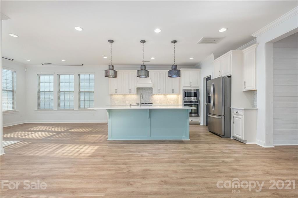 120 Helton Lane Fort Mill, SC 29708 - Photo 8 of 21 a kitchen with stainless steel appliances kitchen island a refrigerator sink and cabinets