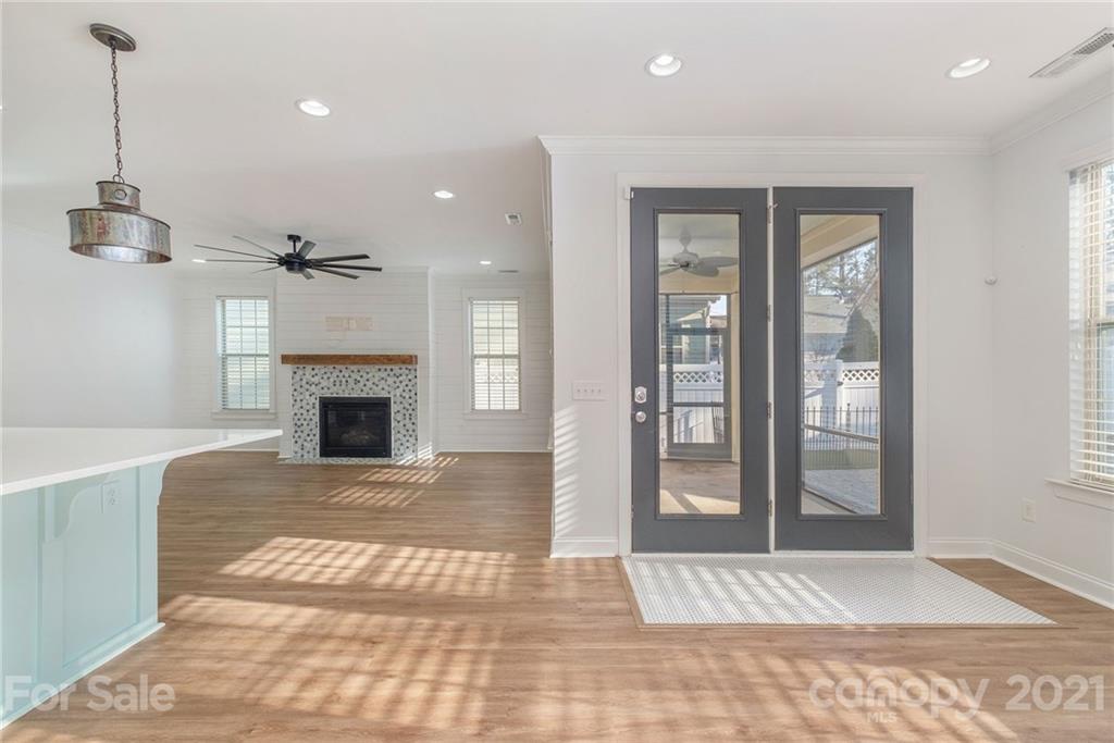 120 Helton Lane Fort Mill, SC 29708 - Photo 9 of 21 a view of an empty room with wooden floor and a fireplace