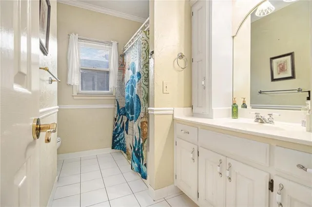 a spacious bathroom with a sink a mirror and a shower