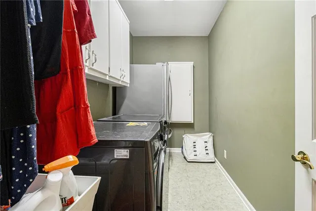 a view of walk in closet with clothes