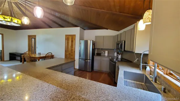 a lobby with furniture and a chandelier