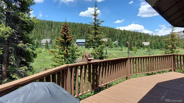a view of a balcony with wooden floor